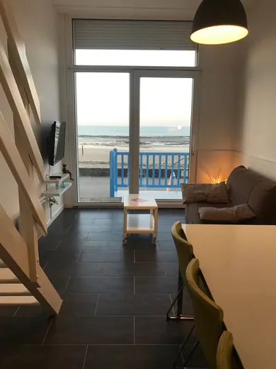 Bright living room opening onto a balcony
