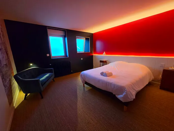 Bedroom with red walls and sea view