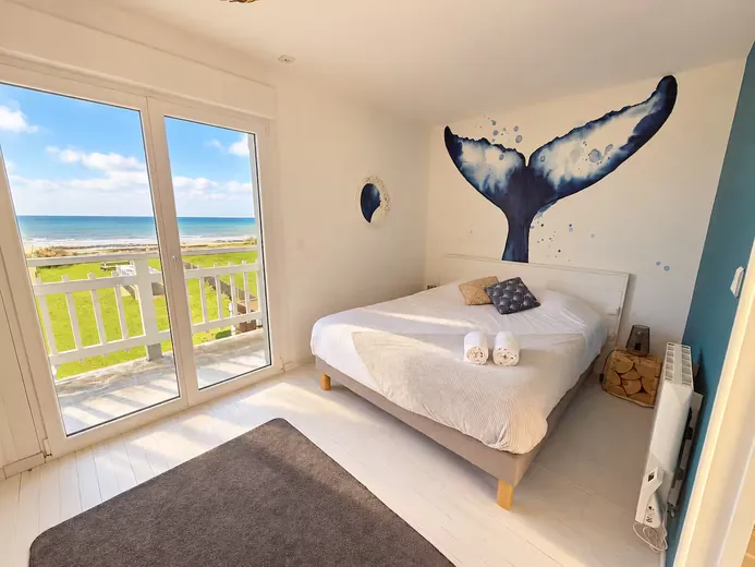 Bedroom with sea view and whale mural