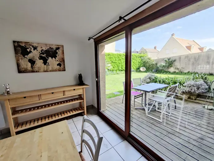 Living room opening onto a wooden deck